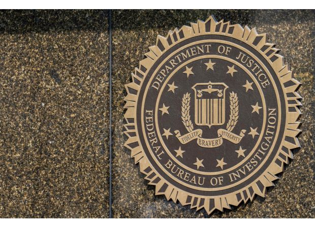 The government is investigating offensive messages with racial slurs that were sent to African Americans.