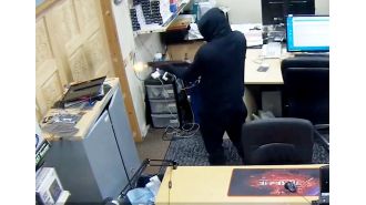 Masked group robs computer store, shoots shotgun at employees.