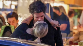 Matty Healy and his fiancée show off their love with a passionate kiss in public in Sydney.