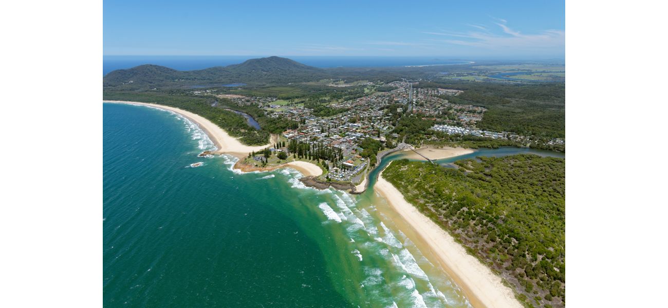 Murder charge for man after body of woman discovered in unit in NSW coastal town.