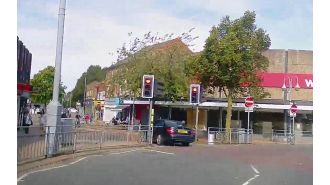 Car almost hit woman pushing pram in police chase.