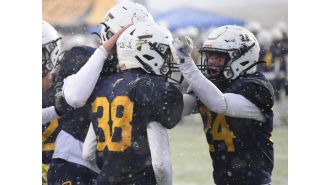 Frederick dominates in snowy 1st-round win.
