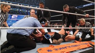WWE wrestler Randy Orton taken from arena on stretcher after using prohibited move.