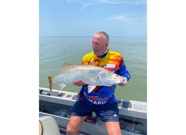 Famous cricketer Ian Botham saved from waters infested with crocodiles.