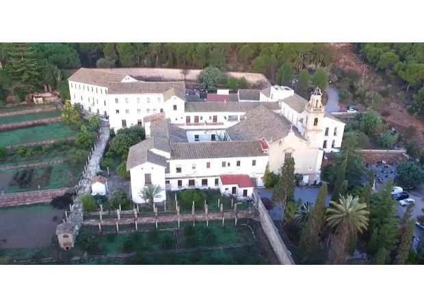 A priest was killed and seven monks were wounded during an assault on a Christian monastery.