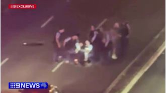 Police use Taser to apprehend man on busy Sydney street.