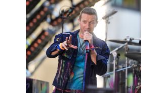 Coldplay interrupts concert to rescue child from being crushed in crowd.