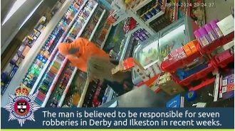 Courageous store owner defends against thief using a mop.