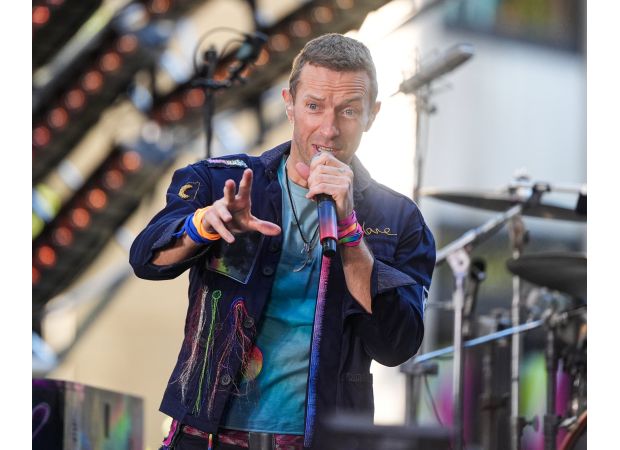 Coldplay interrupts concert to rescue child from being crushed in crowd.