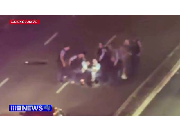 Police use Taser to apprehend man on busy Sydney street.