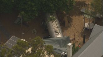 Fatal truck crash at Victorian kindergarten leaves one adult dead and a child wounded.