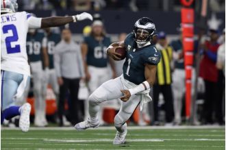 Eagles dominate Cowboys 34-6 with 4 TDs from Hurts, despite Prescott's absence.