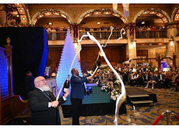 Photos of the annual Champagne Cascade event at The Brown Palace in Denver, now in its 36th year.