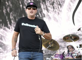 A 2000s rock group drops a supporting act from their tour due to their lead singer getting punched.