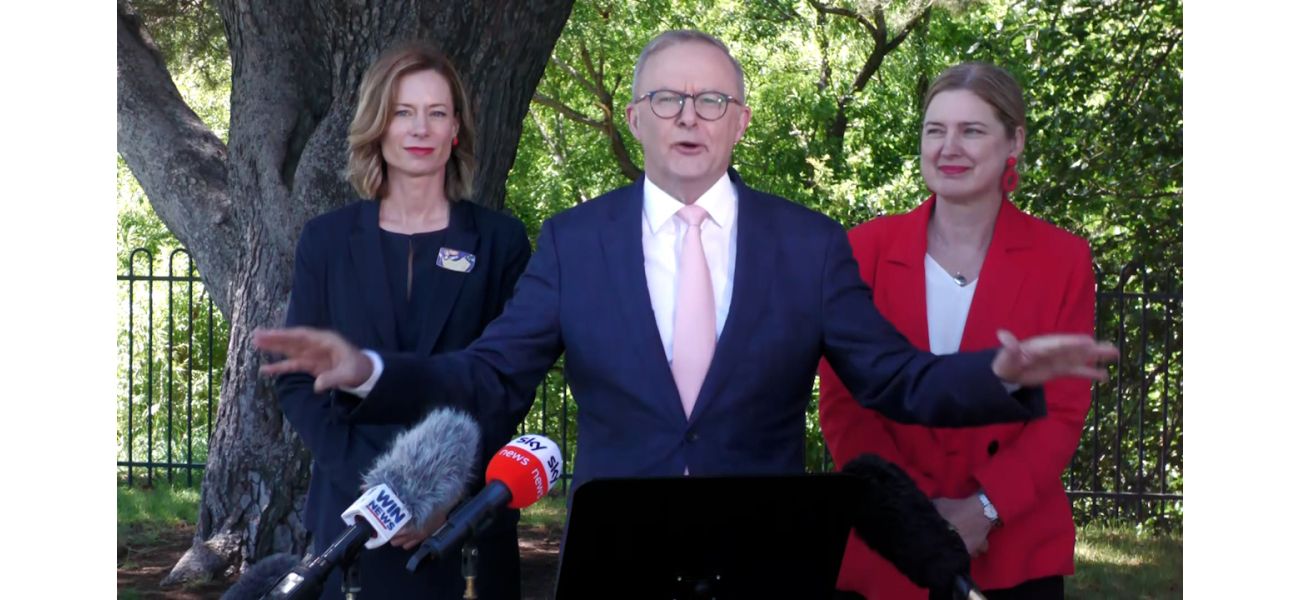 PM interrupted by angry demonstrators during media briefing.