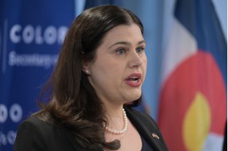 Denver district attorney looking into secretary of state's office for possible security breach of voter system passwords.