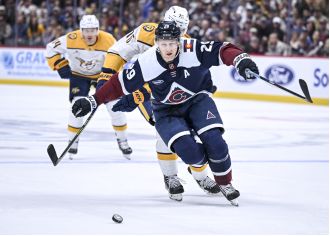 Girard's OT goal secures Avalanche's victory against Predators.