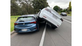 Alert issued as Tesla discovered perched on top of different vehicle in Sydney road.