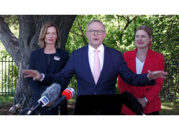 PM interrupted by angry demonstrators during media briefing.