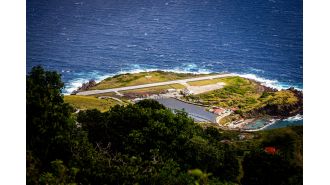Tiniest airport has runway too short for planes, requires waiver for landing.