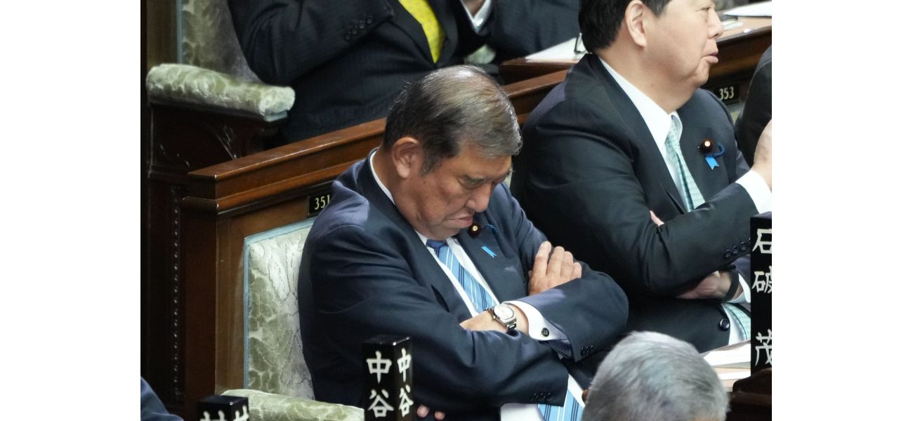 Japan's leader falls asleep during own re-election.