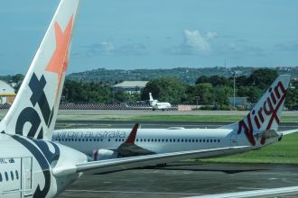 Volcanic eruption in Indonesia causes flight cancellations in Bali due to ash clouds.