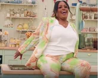 TV host Alison Hammond falls off worktop on Bake Off show.