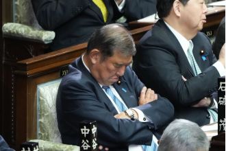 Japan's leader falls asleep during own re-election.