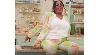 TV host Alison Hammond falls off worktop on Bake Off show.