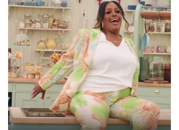 TV host Alison Hammond falls off worktop on Bake Off show.