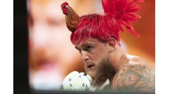 Jake Paul sports a unique hairstyle resembling a rooster as he prepares for his highly anticipated fight against Mike Tyson.