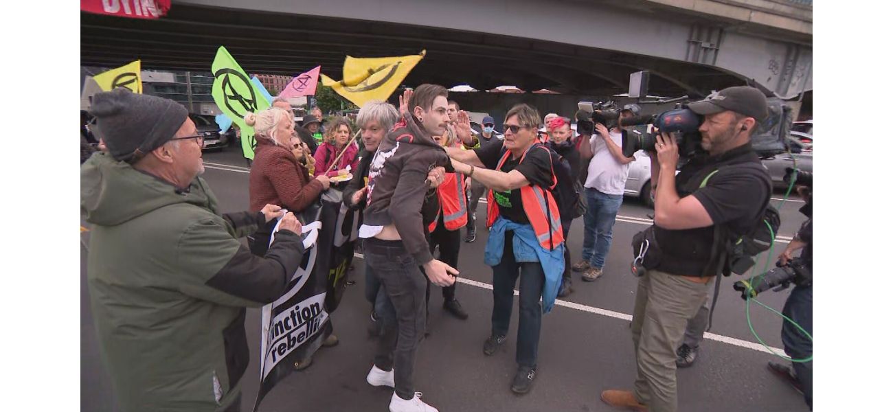 Climate change protesters in Melbourne disrupt traffic by blocking a busy road.