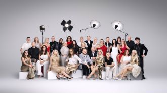 30 rich people celebrate 30 years of the National Lottery by taking a group photo.