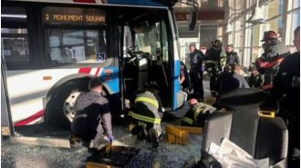 Someone was taken to the hospital by helicopter following a bus accident at a building in Fitchburg.