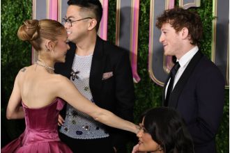 Ariana Grande shows affection with boyfriend Ethan Slater at Wicked premiere in rare display of PDA.