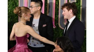 Ariana Grande shows affection with boyfriend Ethan Slater at Wicked premiere in rare display of PDA.
