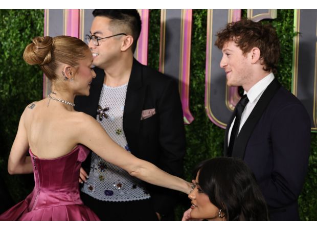 Ariana Grande shows affection with boyfriend Ethan Slater at Wicked premiere in rare display of PDA.