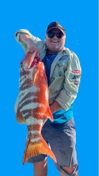 Fisherman catches a massive 11kg, 95cm fish while on a trip with his friends.