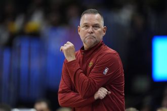 Nuggets coach Malone will be absent from their first NBA Cup game in New Orleans to attend his daughter's volleyball match, which is awesome.