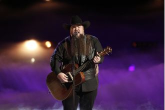 Voice contestant accidentally shoots himself and is taken to hospital.