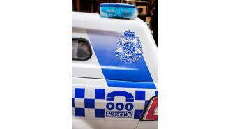 A woman was taken into custody following a close call between her car and a police vehicle.