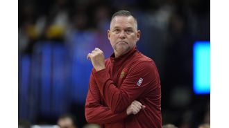 Nuggets coach Malone will be absent from their first NBA Cup game in New Orleans to attend his daughter's volleyball match, which is awesome.