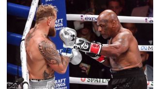 Jake Paul's victory over 58-year-old Mike Tyson in a controversial Netflix fight is met with boos from the audience.