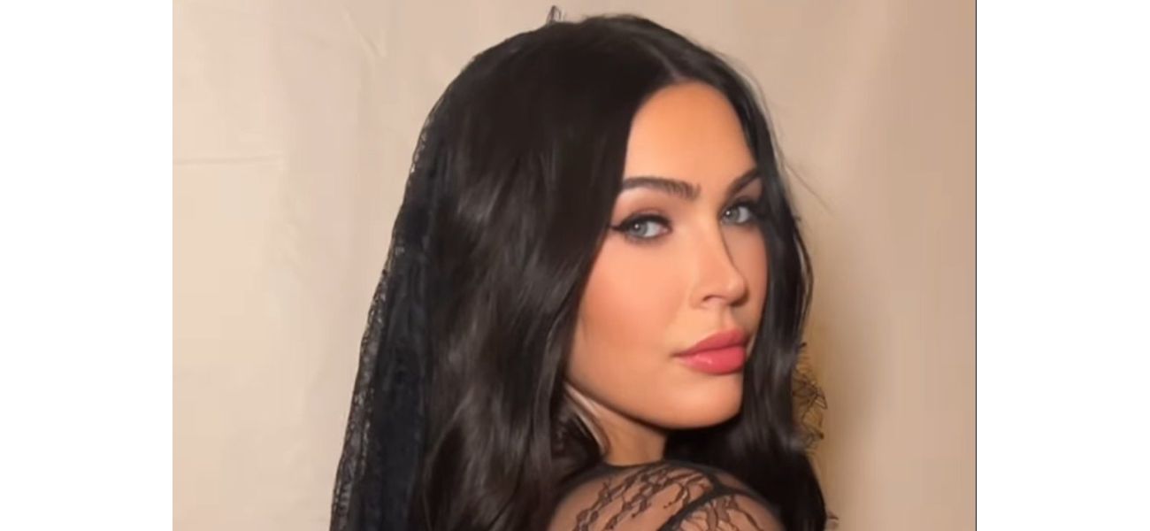 Megan Fox flaunts baby bump in risqué lingerie following unexpected absence from red carpet.