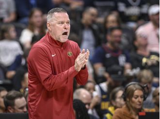 NBA coach Michael Malone, who prioritized his family over his team's championship run, is praised in this week's grading report.