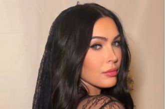 Megan Fox flaunts baby bump in risqué lingerie following unexpected absence from red carpet.