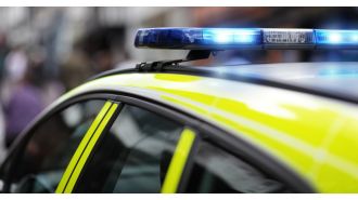 Dead woman discovered in car trunk in London's east side.