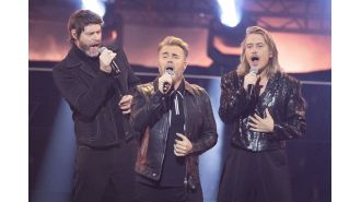 Robbie Williams is scared of re-opening old band wounds while Take That watches his biopic.
