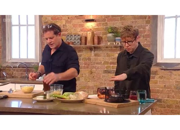 Celebrity from Strictly Come Dancing reprimanded for strange choice to touch stove on weekend cooking show.