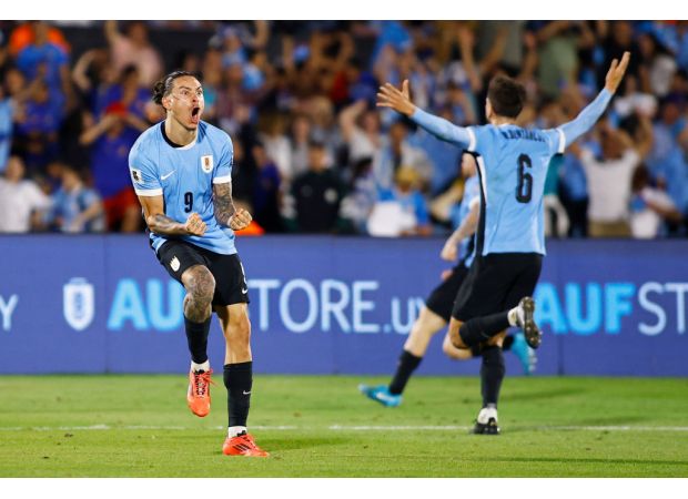 Nunez celebrates in front of past Liverpool opponent in Uruguay victory.